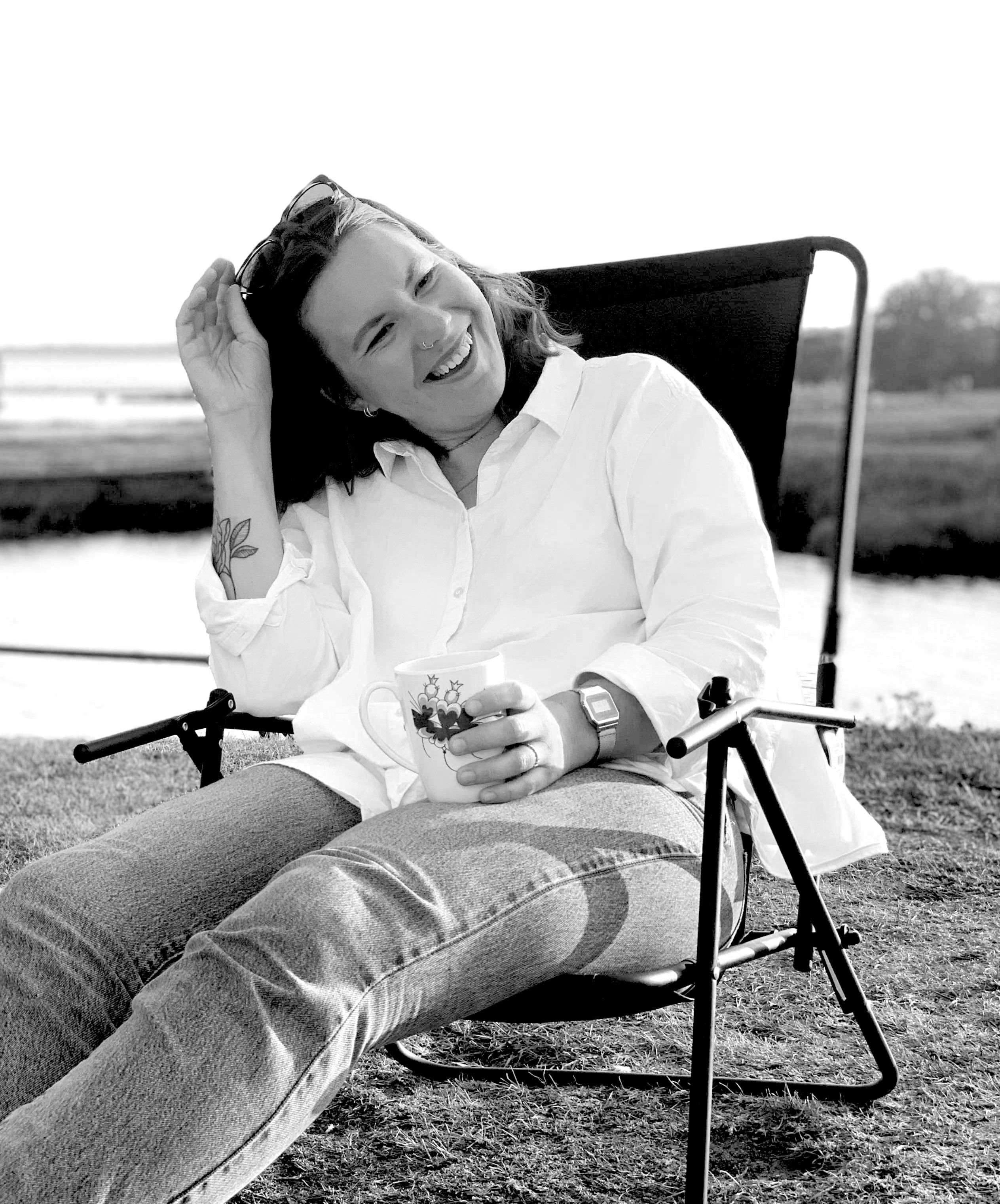 Picture of me. Sitting and holding a coffee cup.